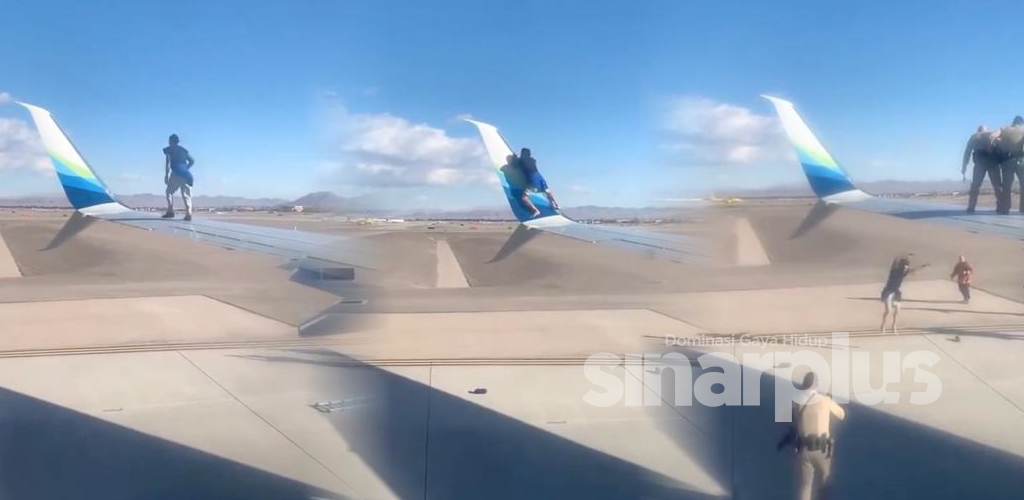 [VIDEO] Penerbangan ‘delay’, ingatkan cuaca buruk, rupa-rupanya ada orang panjat sayap pesawat