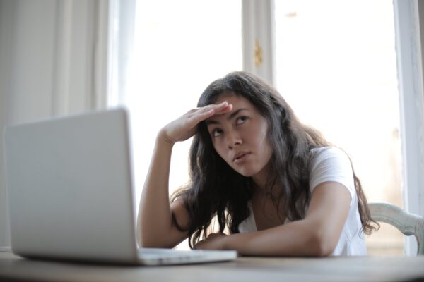 https://www.pexels.com/photo/young-annoyed-female-freelancer-using-laptop-at-home-3808008/